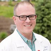 Dr. Mitchell smiling