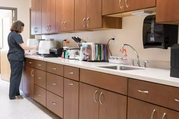 tech stands at the counter with diagnostic tools